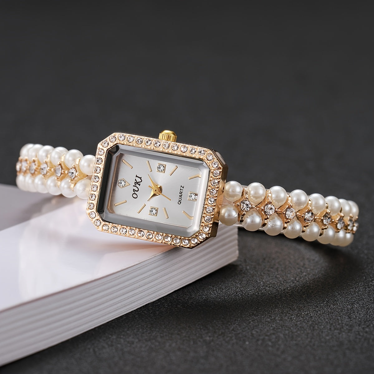 Relógio Feminino Dourado Pérolas — detalhe 1 das peças do conjunto