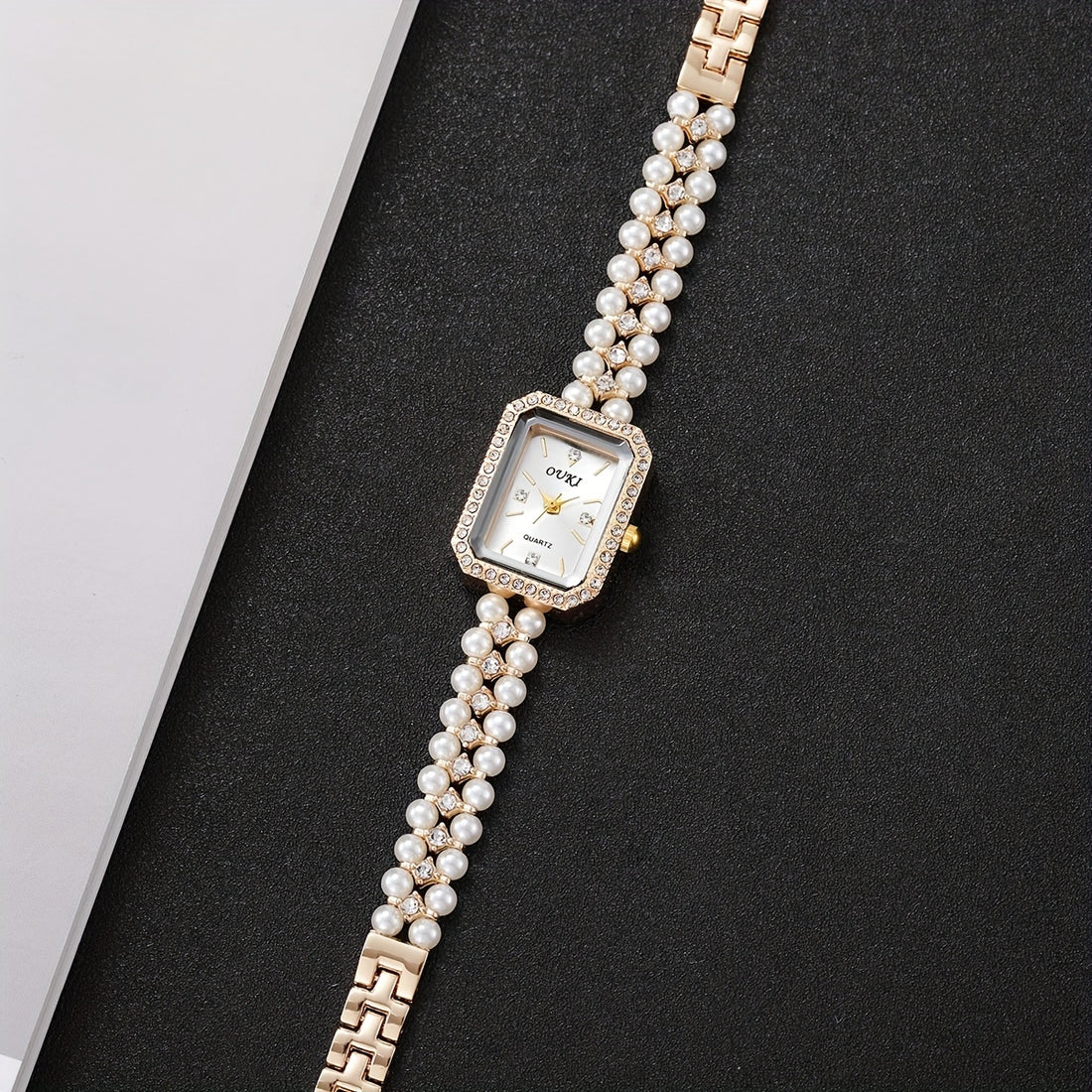 Relógio Feminino Dourado Pérolas — detalhe 9 das peças do conjunto